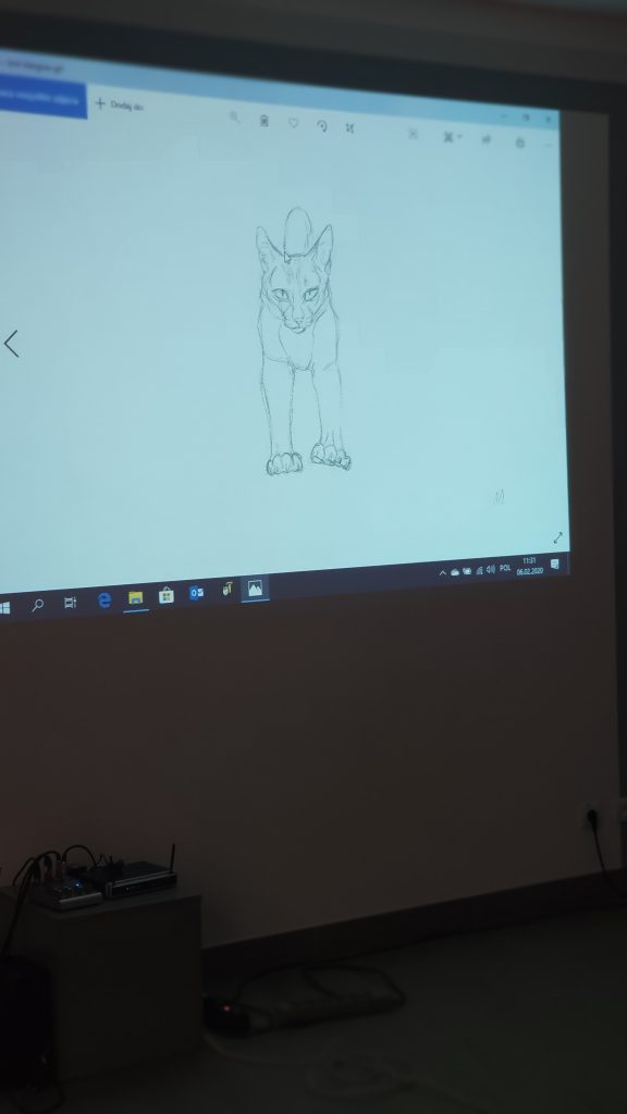 szkic kota na ekranie projektora